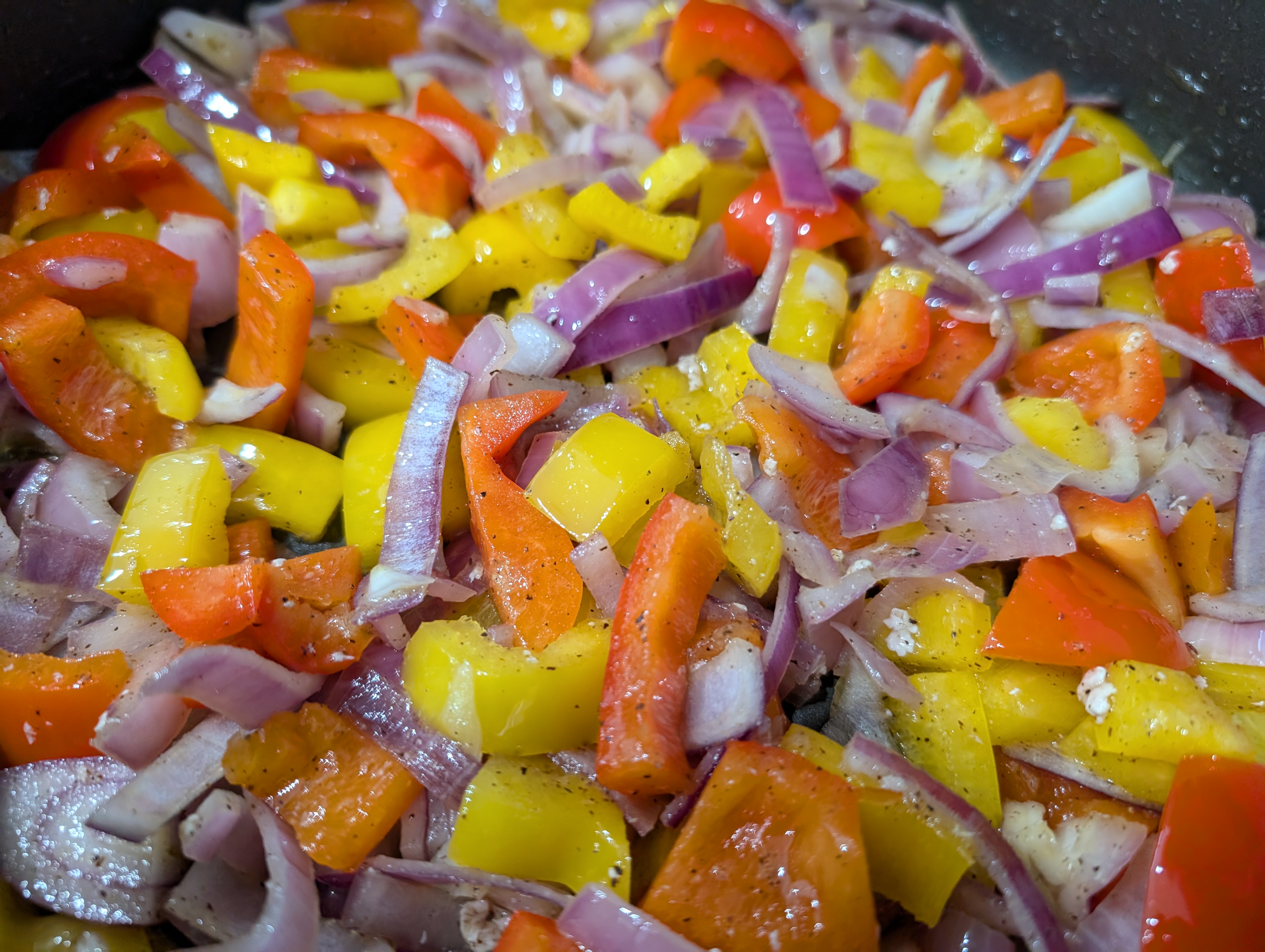 Chopped colorful bell peppers and onions